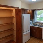 Fridge-on-top, freezer-on-bottom refrigerator w/ LED lighting is available for you use.  Freezer has a built-in icemaker for your enjoyment.  On the left is a large pantry with shelving that can hold any items that you might not want to store in cabinets.