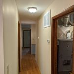 Looking down the hallway towards the entry.  Utility room on the right.