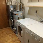 Utility room.  From left to right: High-efficiency furnace and air conditioner will save you money in both warm and cold months.  Next to that there is a commercial quality water heater.  Then, front load washer and dryer!