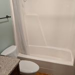 Hall bath has a full one piece bathtub/shower.