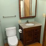 Master bath attached to master bedroom.  Granite countertop on the vanity, high performance Toro commode.