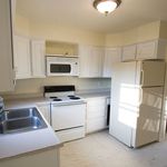 Kitchen. Over the range microwave. Electric stove.  Fridge can also go on wall next to camera