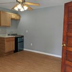 Living room with kitchenette. Convection Microwave available for small monthly fee.