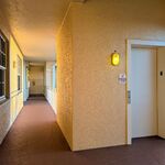 Elevator door is the left.  Unit 304 is the next unit down the hallway.

Looking North.