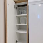 Kitchen cabinets.  Measuring cups and spare storage.

Looking West.

