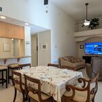 Dining room with tall ceilings.  Seating for 6 close to the kitchen bar.  Family room with 75 inch TV makes it possible to eat and watch, if that is your thing.

Looking Southeast.