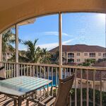 Florida living on the lanai at its best!  Pool in the background, table with four chairs.  All that is missing is you.

Looking West.